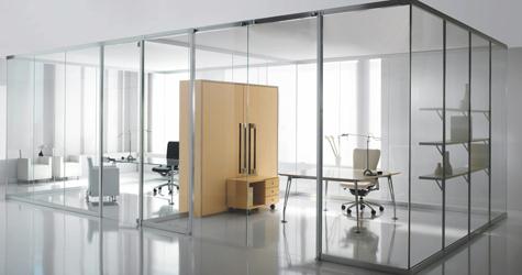 Work spaces divided by glass wall partitions